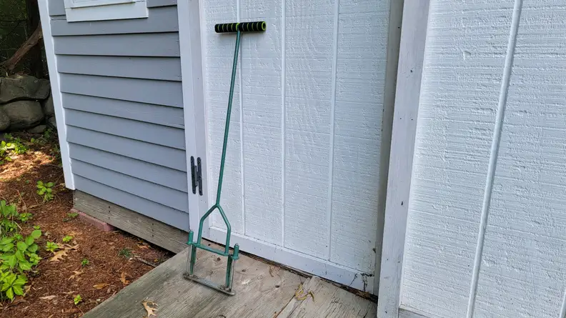 The opmeiro aerator leaned against a shed