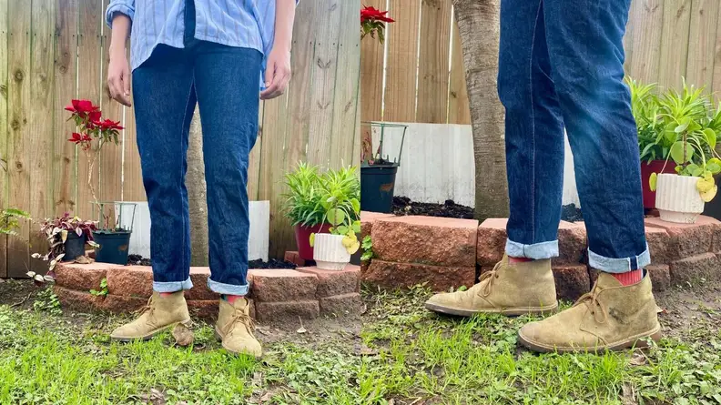 Man wearing distressed teak pair of Clarks Desert Boots.