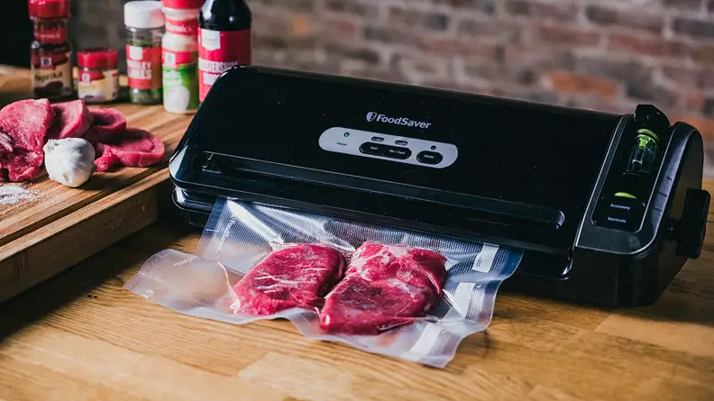 Food saver vacuum sealing cuts of meat