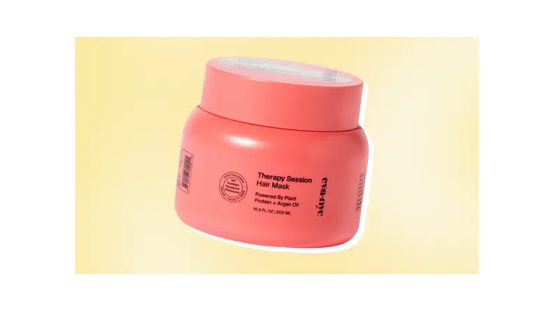 A pink tub of Eva NYC hydrating hair mask against a yellow background.