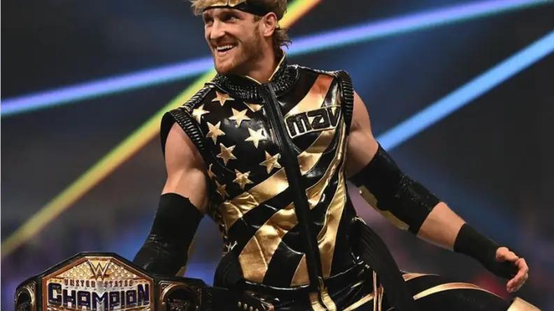 Logan Paul holding the WWE United States Championship at a live event