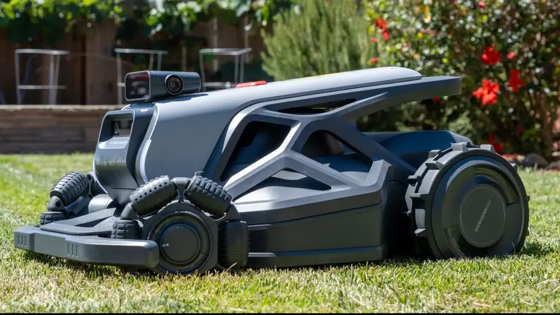 Side profile of AirSeekers Tron Robot Lawn Mower sitting on grass.