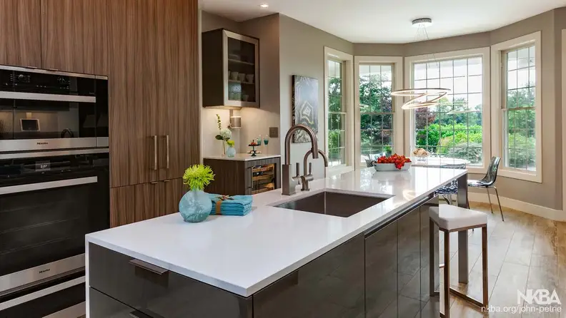 A contemporary kitchen with clean lines, sharp contrasts, and colorful accessories