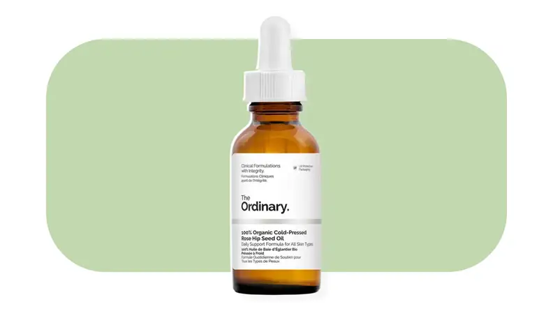 The Ordinary Cold-Pressed Rose Hip Seed Oil against a light green background.