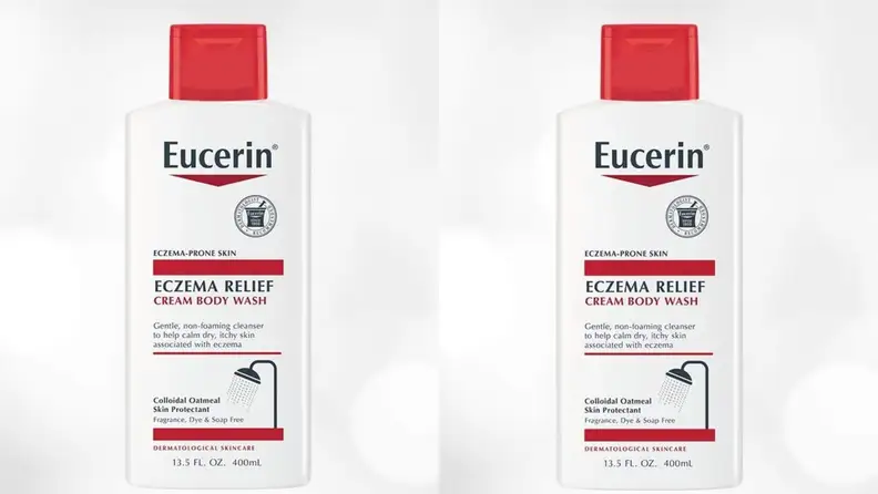 Two bottles of body lotion side by side on a gray background