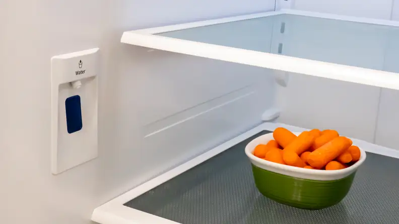The built-in water dispenser, located on the left side of the Hisense HRF266N6CSE French-door refrigerator.