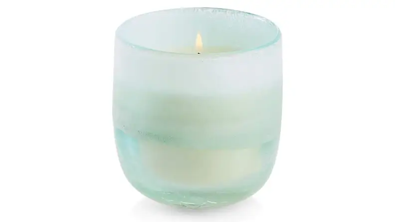 A light green glass candle holder