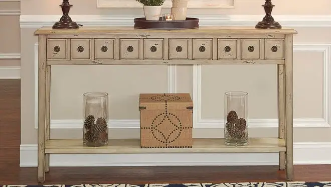 Tan console table in hallway.