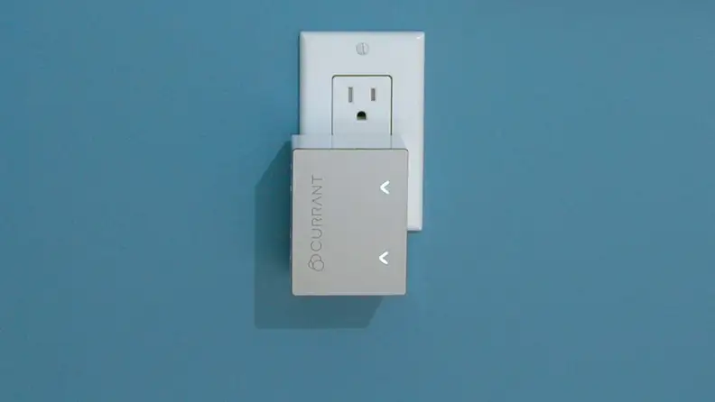 The Currant smart plug is plugged into the socket.
