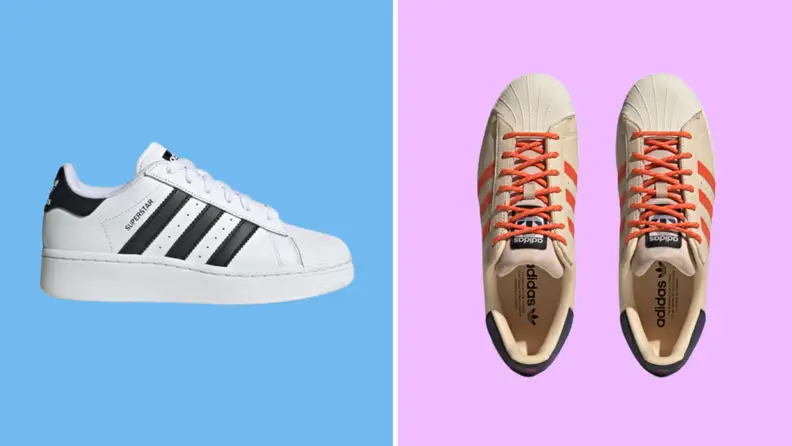 Two pairs of sneakers: On the left is a white Adidas Superstar with black stripes, and on the right is a pair of beige Superstars with orange laces.