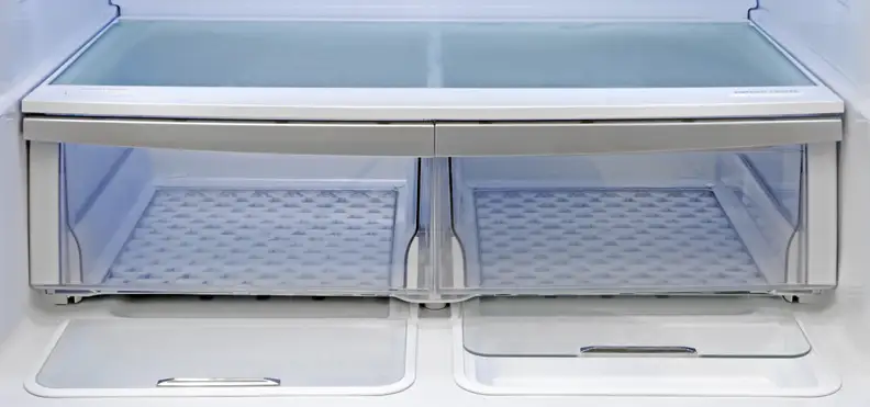 Both of the Kenmore Elite 72483's crispers are roomy and slide with ease. Plus, recessed into the bottom of the fridge compartment right in front of the crispers, you find two extra storage areas.
