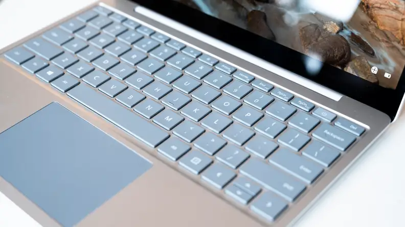 The laptop's keyboard and trackpad