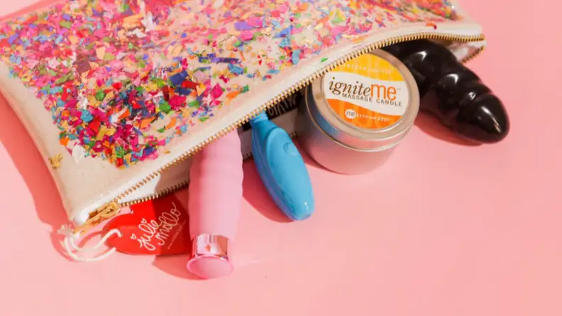 Sex toy products including a vibrator in a Julie Mollo bag.