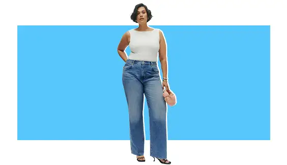 A model wearing a white tank with denim wide-leg jeans.