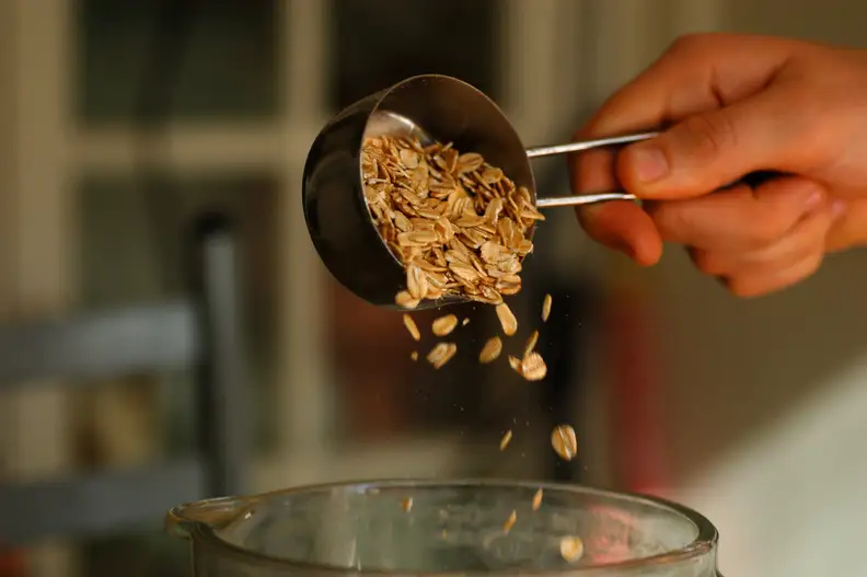 measuring cup with oats