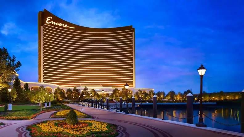 A brightly lit casino hotel at dusk
