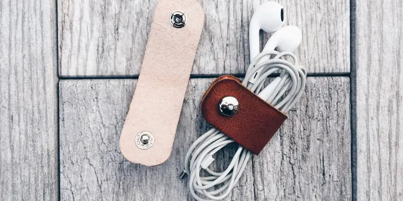 These smart leather cable organizer are a great stocking stuffer, wrapping around your headphones so they don't get tangled.