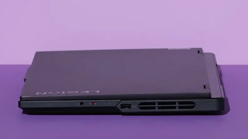 Close-up side shot of the black Lenovo Legion Pro 5i Gen 8 gaming laptop closed to display more ports on the right-hand side.