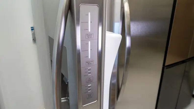 Side control panels on the stainless steel Frigidaire FRSS2623AS side-by-side.