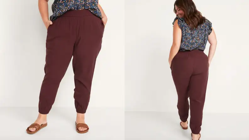 A model wears burgundy joggers.