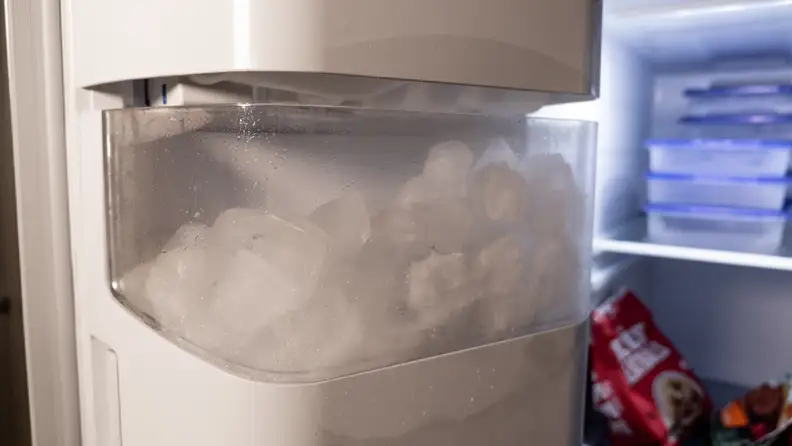 A close-up of the Samsung RS27T5200SR's ice maker.