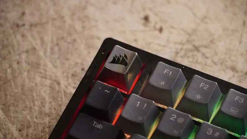 Close-up of the Escape key with the Corsair logo.