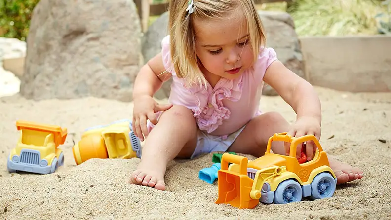 girl playing in sand