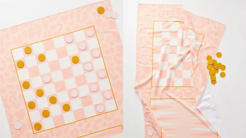 A peach colored towel with a checkers board print.