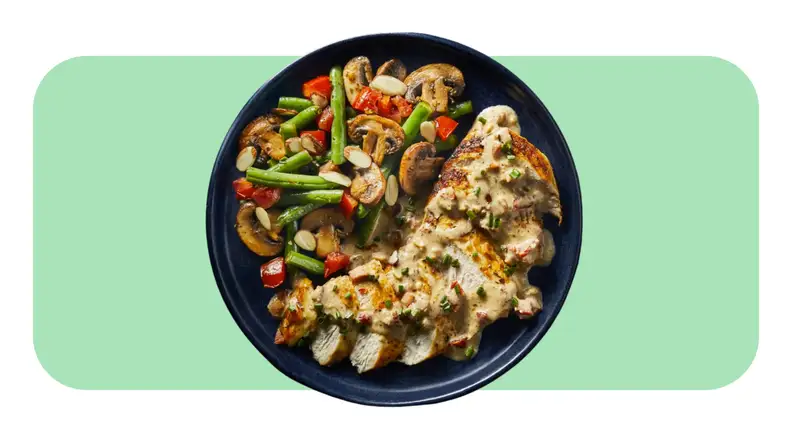 A served plate of Chicken with Creamy Bacon Sauce and veggies from the Green Chef meal kit.