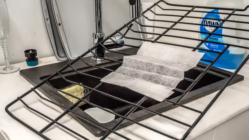 If you're having trouble cleaning your oven racks, try soaking them in hot water with a dryer sheet.