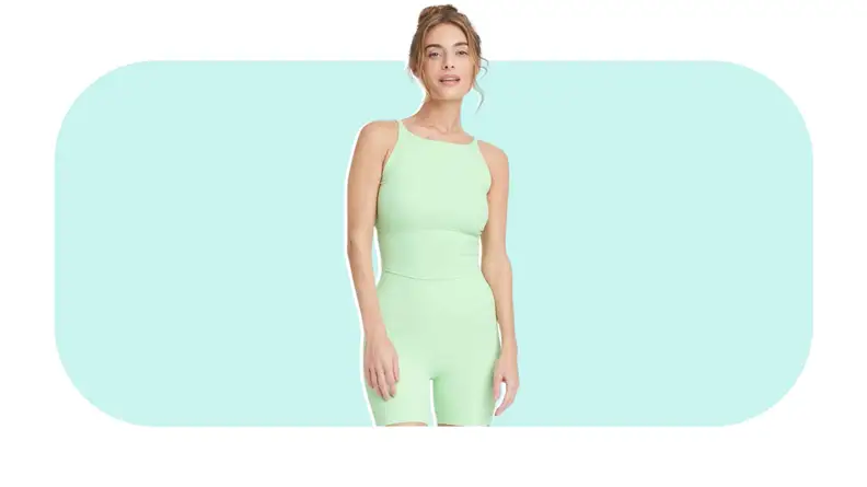 Model showcasing pastel green Women’s Everyday Soft Crop Tank Top and matching shorts.