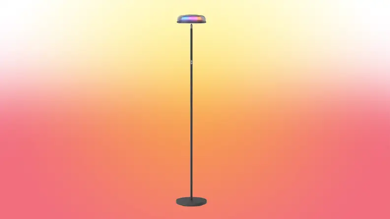 A lamp stands on a red and yellow fade background