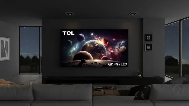 The 115-inch TCL QM89 mini-LED TV taking up most of the space on a wall in a modern living room setting