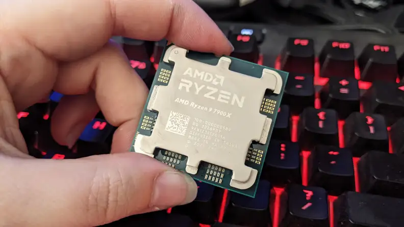 Holding a computer processor in-between fingers