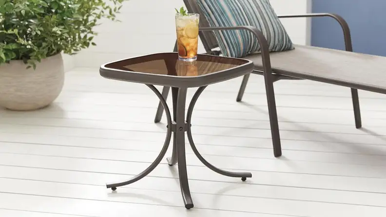 A glass-top side table