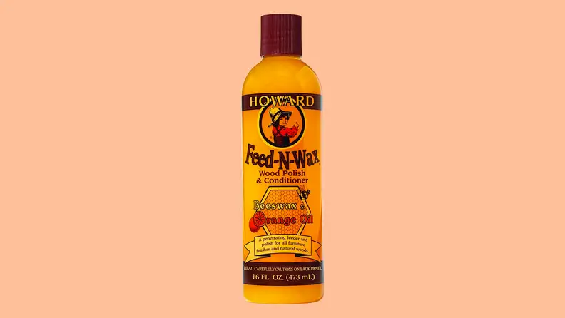 Wood polish against a peach background