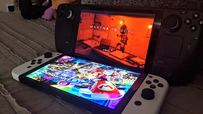 Two handheld gaming consoles next to one another