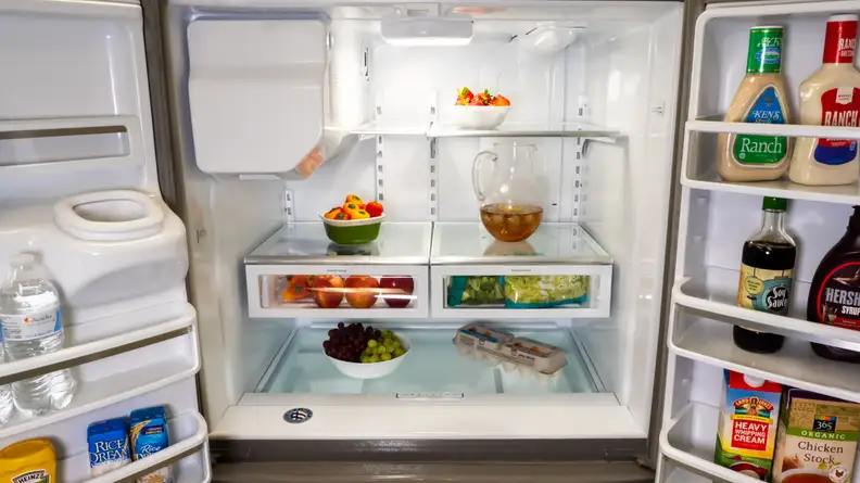 A shot of the interior of the Whirlpool WRX735SDHZ French door refrigerator, filled with food for scale.