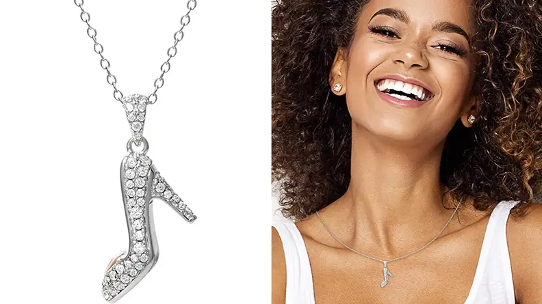 Woman wearing glass slipper necklace.