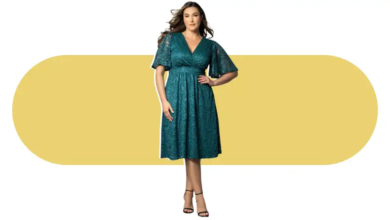 A model wearing a teal dress with lace accents.