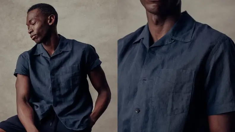 man wearing deep navy blue camp collar shirt, closer shot of navy blue camp collar shirt from Buck Mason