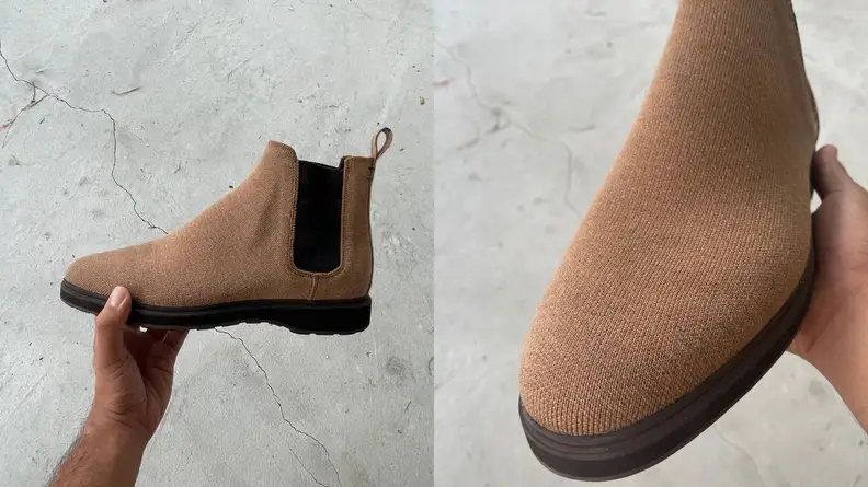 Man holding Rothy's Merino Chelsea Boot in hand, close-up of upper on Rothy's Merino Chelsea Boot.