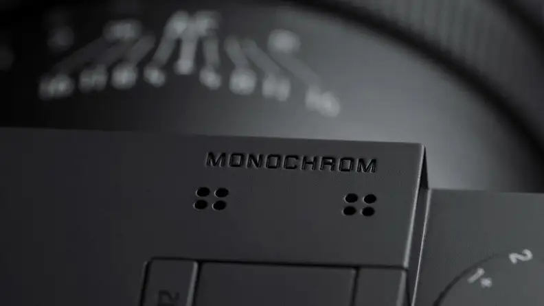 A close up of an engraved word on the top of a camera