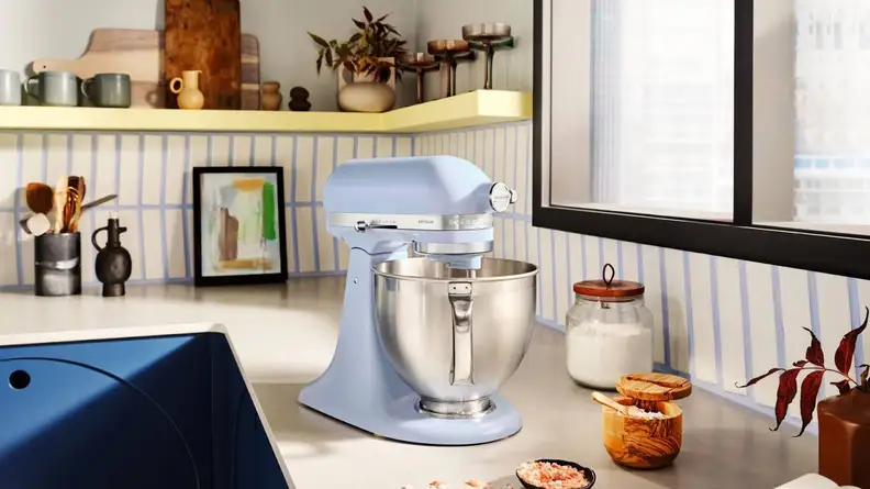 KitchenAid Stand Mixer in new Blue Salt color on kitchen countertop in front of window indoors