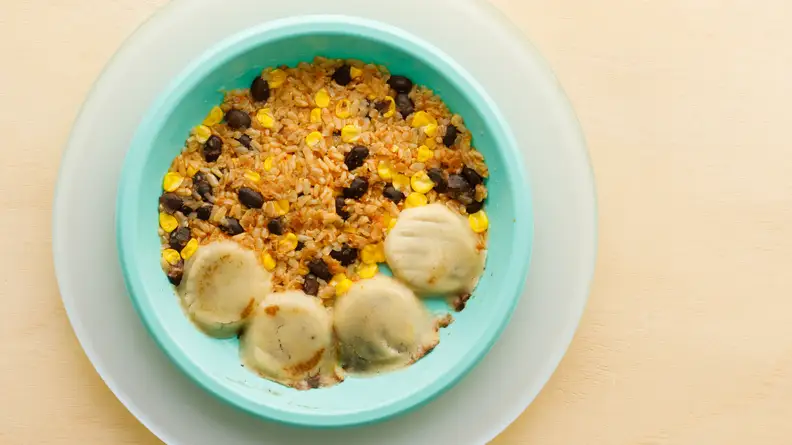 Plate of pupusas and Spanish rice