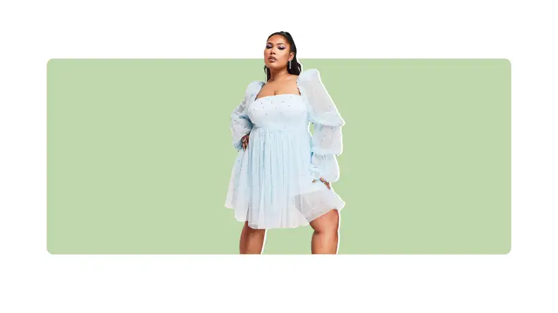 A light blue tulle dress that is encrusted with pearl details.