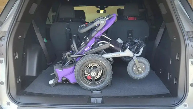 The Convaid Coaster stroller folded down in the trunk of a car