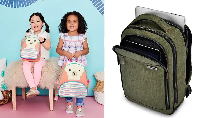 Two girls pose with a llama backpack. Another olive green backpack is to the right.