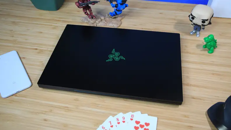 The Razer Blade 16, closed, on a desk.