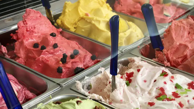 Many flavors of gelato in a shop's freezer case